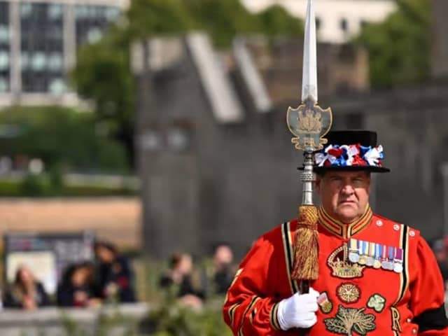 A Yeomen Warders stands guard for the Death Gun Salute fired at the Tower of London by the Honourable Artillery Company, British Army, taking place to mark the death of Queen Elizabeth II.