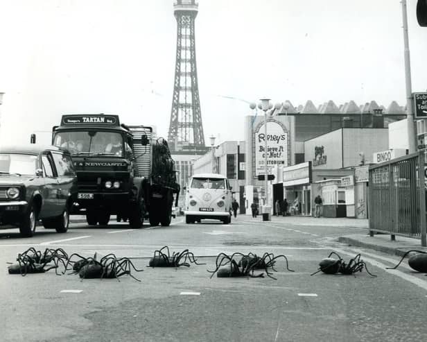Ten giant spiders, which were starring in the BBC series at the time, stop the traffic on Blackpool Promenade as they make their way to the Dr Who Exhibition in 1974