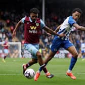 BURNLEY, ENGLAND - APRIL 13: Lyle Foster of Burnley is tackled by Joao Pedro of Brighton & Hove Albion during the Premier League match between Burnley FC and Brighton & Hove Albion at Turf Moor on April 13, 2024 in Burnley, England. (Photo by Lewis Storey/Getty Images)