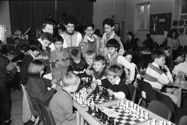 Spectators crowd round at the Jack Robinson Memorial Chess Congress on Saturday.
The Jack Robinson Memorial Chess Congress was held on Saturday at St. Peter’s C of E Primary School, Burnley and the prizes were presented by the late Mr. Robinson’s wife, Mrs. J. Robinson. In the under-9s section the winner was Brendan Newell, of Trafford Junior Knights. The Jack Robinson Memorial Trophy for the best East Lancashire player was won by Mark Middleton of Gisburn Road CP School, Barnoldswick.
