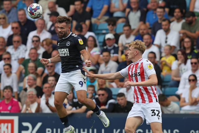 LONDON, ENGLAND - JULY 30: Tom Bradshaw of Millwall and Connor Taylor of Stoke City during the Sky Bet Championship match between Millwall and Stoke City at The Den on July 30, 2022 in London, United Kingdom. (Photo by Henry Browne/Getty Images)