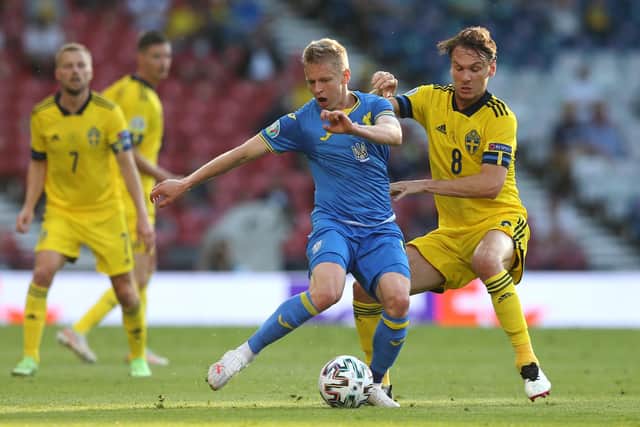 GLASGOW, SCOTLAND - JUNE 29: Oleksandr Zinchenko of Ukraine is challenged by Albin Ekdal of Sweden during the UEFA Euro 2020 Championship Round of 16 match between Sweden and Ukraine at Hampden Park on June 29, 2021 in Glasgow, Scotland. (Photo by Robert Perry - Pool/Getty Images)