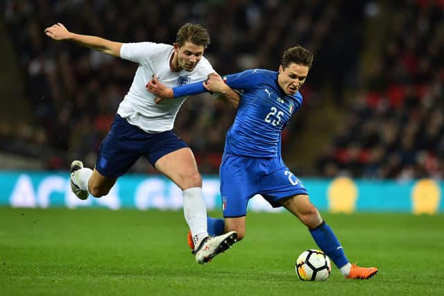 England's defender James Tarkowski (L) vies with Italy's striker Federico Chiesa during the International friendly football match between England and Italy at Wembley stadium in London on March 27, 2018. The game finished 1-1. / GLYN KIRK/AFP via Getty Images