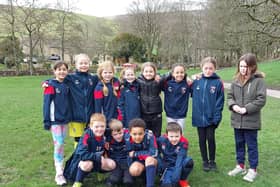Some of the players from Fulledge Colts under nine girls and under eights Clarets teams at Barley picnic site before setting off on their trek up Pendle Hill