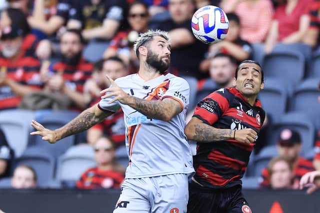 SYDNEY, AUSTRALIA - OCTOBER 22:  Charlie Austin of the Roar competes for the ball with Gabriel Cleur of the Wanderers during the round three A-League Men's match between Western Sydney Wanderers and Brisbane Roar at CommBank Stadium, on October 22, 2022, in Sydney, Australia. (Photo by Mark Evans/Getty Images)