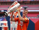 LONDON, ENGLAND - MAY 30: Daniel Ballard of Blackpool  celebrates with the trophy after winning the Sky Bet League One Play-off Final match between Blackpool and Lincoln City at Wembley Stadium on May 30, 2021 in London, England. A limited number of fans will be allowed into the stadium as Coronavirus restrictions begin to ease in the UK following the COVID-19 pandemic. (Photo by Catherine Ivill/Getty Images)