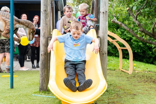 Cole (six) on the slide at the Tay Street Family Hub launch. Photo: Kelvin Lister-Stuttard