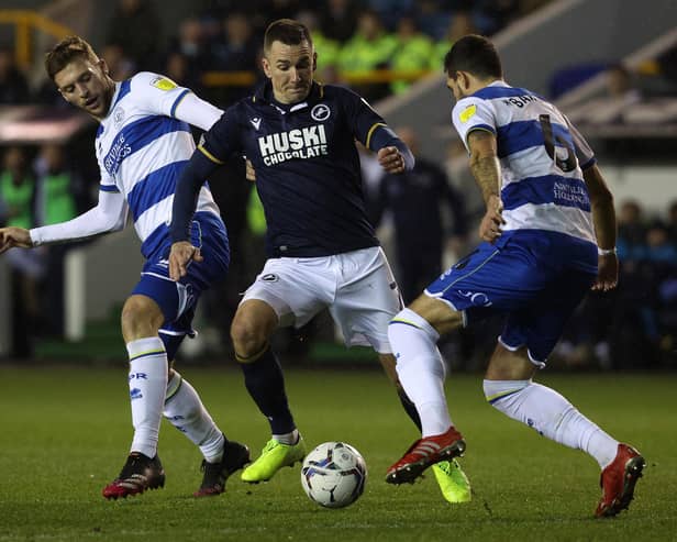 LONDON, ENGLAND - FEBRUARY 15: Jed Wallace of Millwall is challenged by Sam Field and Yoann Barbet of Queens Park Rangers during the Sky Bet Championship match between Millwall and Queens Park Rangers at The Den on February 15, 2022 in London, England. (Photo by Andrew Redington/Getty Images)