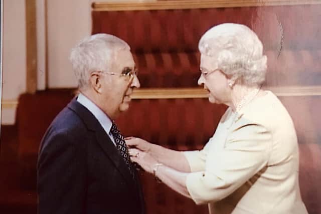Burnley's Weavers' Triangle Trust chairman Brian Hall receiving his MBE from Her Majesty Queen Elizabeth II