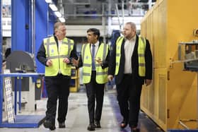 Prime Minister RIshi Sunak flanked by managing director Neil Evans and MP Antony Higginbotham during a visit to VEKA today