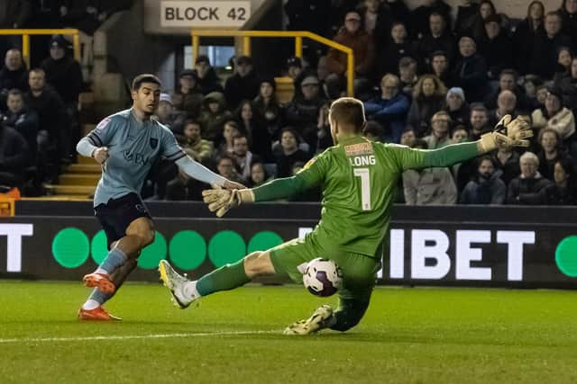 Millwall's George Long saves under pressure from Burnley's Anass Zaroury (left) 

The EFL Sky Bet Championship - Millwall v Burnley - Tuesday 21st February 2023 - The Den - London