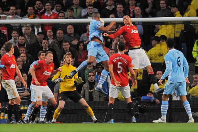 Manchester City's Belgian footballer Vincent Kompany (4th R) scores his team's first goal against Manchester United during their English Premier League match at The Etihad Stadium in Manchester, north-west England, on April 30, 2012. AFP PHOTO/ANDREW YATES