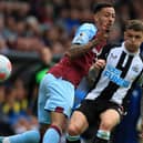 Newcastle United's English defender Kieran Trippier (R) vies with Burnley's English midfielder Dwight McNeil (L) during the English Premier League football match between Burnley and Newcastle United at Turf Moor in Burnley, north west England on May 22, 2022.