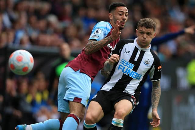 Newcastle United's English defender Kieran Trippier (R) vies with Burnley's English midfielder Dwight McNeil (L) during the English Premier League football match between Burnley and Newcastle United at Turf Moor in Burnley, north west England on May 22, 2022.