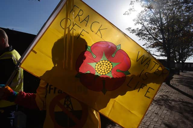 Familiar anti-fracking flags were waved outside County Hall