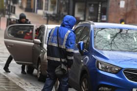 One of Lancashire County Council's parking enforcement officers on patrol -  the authority generated £1.89m in parking fines in 2020/21