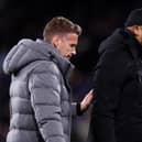 BURNLEY, ENGLAND - JANUARY 12: Rob Edwards, Manager of Luton Town, (L) and Vincent Kompany, Manager of Burnley, (R) interact prior to kick-off ahead of the Premier League match between Burnley FC and Luton Town at Turf Moor on January 12, 2024 in Burnley, England. (Photo by Naomi Baker/Getty Images)