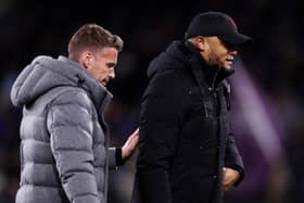BURNLEY, ENGLAND - JANUARY 12: Rob Edwards, Manager of Luton Town, (L) and Vincent Kompany, Manager of Burnley, (R) interact prior to kick-off ahead of the Premier League match between Burnley FC and Luton Town at Turf Moor on January 12, 2024 in Burnley, England. (Photo by Naomi Baker/Getty Images)