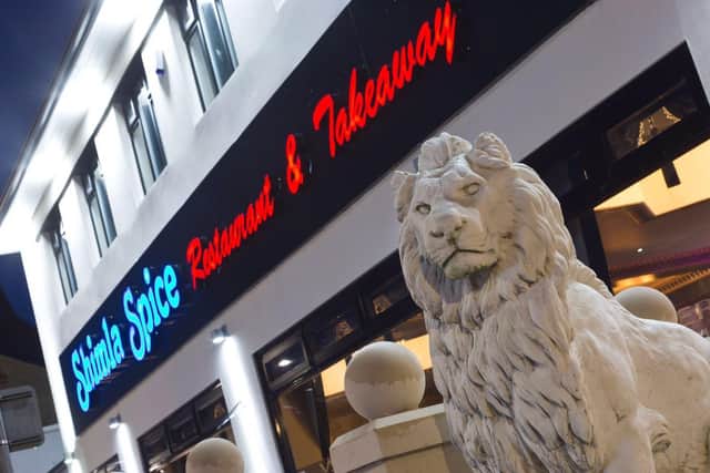 One of the two lions greets you at the entrance to Burnley's Shimla Spice restaurant