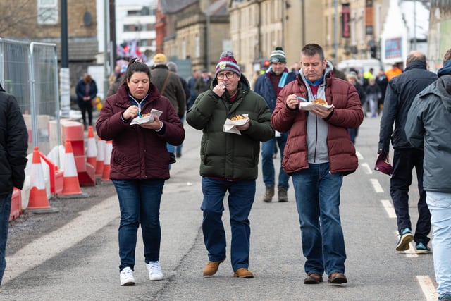 Burnley fans arrive at Turf Moor ahead of the Championship fixture with Wigan Athletic. Photo: Kelvin Stuttard