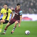 LONDON, ENGLAND - MARCH 10: Nayef Aguerd of West Ham United holds off Sander Berge of Burnley  during the Premier League match between West Ham United and Burnley FC at London Stadium on March 10, 2024 in London, England. (Photo by Justin Setterfield/Getty Images)
