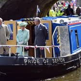 Queen Elizabeth II, The Duke of Edinburgh and The Prince of Wales  make their way along the Leeds and Liverpool canal on the barge 'Pride Of Sefton', during a trip to Burnley, Lancashire. PRESS ASSOCIATION Photo. Picture date: Wednesday May 16, 2012. The Queen and Duke are taking part in a two day tour of the North West as part of this years Jubilee celebrations. Photo credit should read: Christopher Furlong/PA Wire