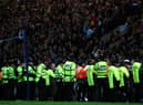 PRESTON, UNITED KINGDOM - APRIL 22:  Police and stewards stand in front of the supporters of Burnley during the Sky Bet Championship match between Preston North End and Burnley at Deepdale on April 22, 2016 in Preston, England.  (Photo by Alex Livesey/Getty Images)