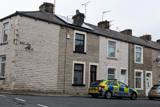 Police at the scene of a possible homicide on Harley Street, Burnley.