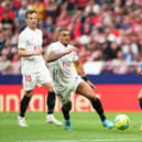 MADRID, SPAIN - MAY 15: Luis Suarez of Atletico Madrid battles for possession with Diego Carlos of Sevilla during the LaLiga Santander match between Club Atletico de Madrid and Sevilla FC at Estadio Wanda Metropolitano on May 15, 2022 in Madrid, Spain. (Photo by Juan Manuel Serrano Arce/Getty Images)