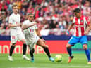MADRID, SPAIN - MAY 15: Luis Suarez of Atletico Madrid battles for possession with Diego Carlos of Sevilla during the LaLiga Santander match between Club Atletico de Madrid and Sevilla FC at Estadio Wanda Metropolitano on May 15, 2022 in Madrid, Spain. (Photo by Juan Manuel Serrano Arce/Getty Images)