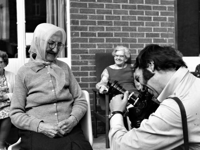 Granada cameraman Mike Blakeley takes a shot of the oldest Holly House resident, Mrs Minnie Ingham.
A television film unit from Granada visited a model housing complex for the aged - in Holmes Street, Burnley - on Thursday 29th May 1971