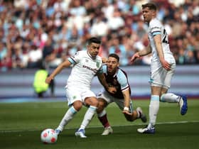 LONDON, ENGLAND - APRIL 17: Mathew Lowton of Burnley clears the ball away from Nikola Vlasic of West Ham United during the Premier League match between West Ham United and Burnley at London Stadium on April 17, 2022 in London, England. (Photo by Steve Bardens/Getty Images)