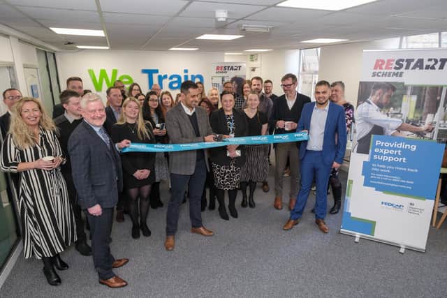 Burnley Council leader Councillor Afrasiab Anwar cuts the ribbon at the opening of Fed Cap