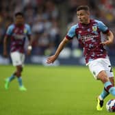 HUDDERSFIELD, ENGLAND - JULY 29: Josh Cullen of Burnley keeps possession of the ball during the Sky Bet Championship match between Huddersfield Town and Burnley at John Smith's Stadium on July 29, 2022 in Huddersfield, England. (Photo by Ashley Allen/Getty Images)