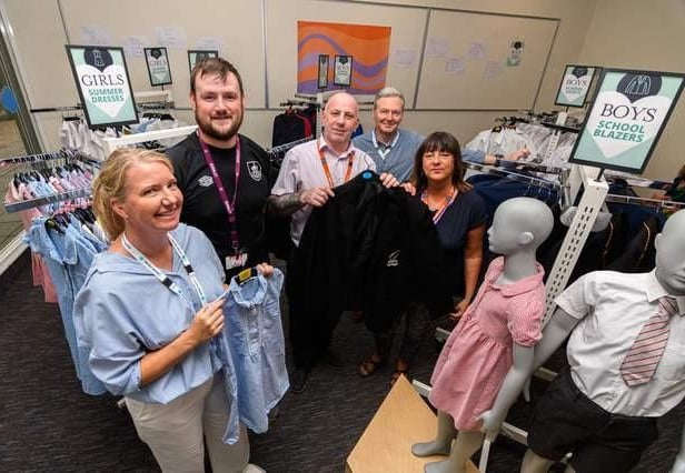 Volunteers (left to right) Cathryn Swift, Nathan Norris, Mark Hull, Dominic Cooper and Maria Bolton inside the free school uniform shop in Burnley on its opening day. The shop kitted out 710 children
