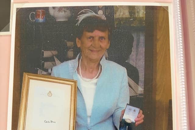 Annie Isherwood, who turns 100 this month, with her medal and certificate she received in 2008 for being part of the Womens' Land Army