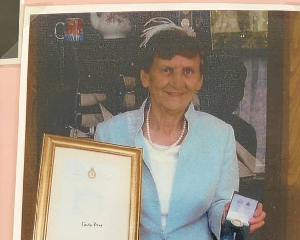 Annie Isherwood, who turns 100 this month, with her medal and certificate she received in 2008 for being part of the Womens' Land Army