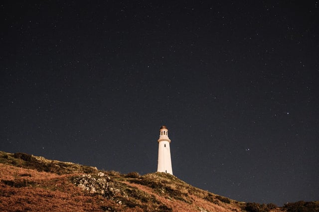 The Hoad Monument - also known as the Sir John Barrow Monument - stands clear against the night sky in Ulverston