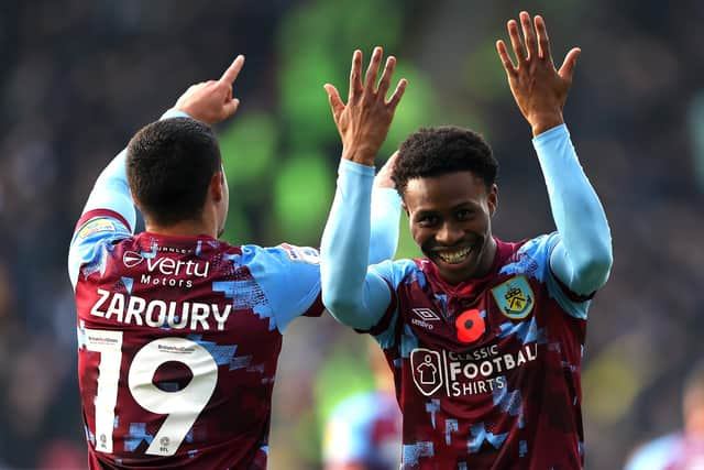 BURNLEY, ENGLAND - NOVEMBER 13: Anass Zaroury of Burnley celebrates with teammate Nathan Tella after scoring their side's second goal during the Sky Bet Championship between Burnley and Blackburn Rovers at Turf Moor on November 13, 2022 in Burnley, England. (Photo by Nathan Stirk/Getty Images)