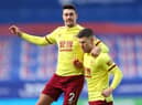 LONDON, ENGLAND - FEBRUARY 13: Johann Gudmundsson of Burnley celebrates with teammate Matthew Lowton after scoring his team's first goal during the Premier League match between Crystal Palace and Burnley at Selhurst Park on February 13, 2021 in London, England. (Photo by Julian Finney/Getty Images)