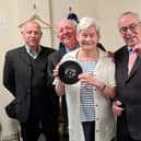 Katie Lancaster with The Barron Knights and the record she dug out from her loft to auction in a bid to raise cash for Ukraine