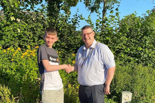 Longridge's new Youth Mayor Josh Kirby pictured being congratulated on his new role by Longridge Mayor Coun Nick Stubbs