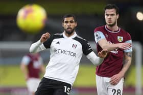 BURNLEY, ENGLAND - FEBRUARY 17: Ruben Loftus-Cheek of Fulham and Kevin Long of Burnley chase downth during the Premier League match between Burnley and Fulham at Turf Moor on February 17, 2021 in Burnley, England. Sporting stadiums around the UK remain under strict restrictions due to the Coronavirus Pandemic as Government social distancing laws prohibit fans inside venues resulting in games being played behind closed doors. (Photo by Carl Recine - Pool/Getty Images)