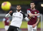 BURNLEY, ENGLAND - FEBRUARY 17: Ruben Loftus-Cheek of Fulham and Kevin Long of Burnley chase downth during the Premier League match between Burnley and Fulham at Turf Moor on February 17, 2021 in Burnley, England. Sporting stadiums around the UK remain under strict restrictions due to the Coronavirus Pandemic as Government social distancing laws prohibit fans inside venues resulting in games being played behind closed doors. (Photo by Carl Recine - Pool/Getty Images)