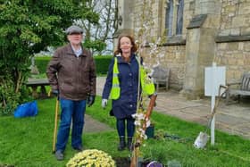 Clitheroe Rotary  Club planted tree in the grounds of St. Mary's Parish Church with president Karin Wilson, assisted by incoming President, Robert Irwin, performing the honours.