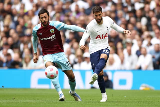 LONDON, ENGLAND - MAY 15: Rodrigo Bentancur of Tottenham Hotspur is challenged by Dwight McNeil of Burnley during the Premier League match between Tottenham Hotspur and Burnley at Tottenham Hotspur Stadium on May 15, 2022 in London, England. (Photo by Ryan Pierse/Getty Images)