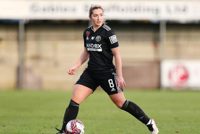 BAMBER BRIDGE, ENGLAND - DECEMBER 05: Maddy Cusack of Sheffield United runs with the ball during the FA Women's Continental Tyres League Cup match between Blackburn Rovers and Sheffield United at Bamber Bridge on December 05, 2021 in Bamber Bridge, England. (Photo by Charlotte Tattersall/Getty Images)