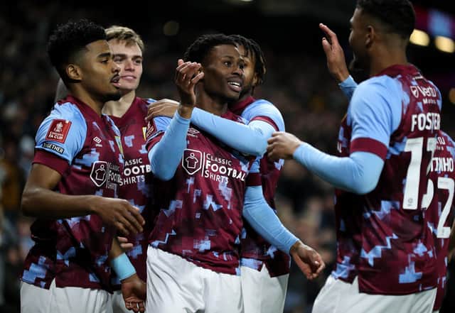Burnley's Nathan Tella (centre) celebrates scoring the opening goal with teammates 

The Emirates FA Cup Fourth Round Replay - Burnley v Ipswich Town - Tuesday 7th February 2023 - Turf Moor - Burnley