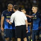 BURNLEY, ENGLAND - MARCH 14:  Vincent Kompany of Manchester City speaks to Referee Andre Marriner  during the Barclays Premier League match between Burnley and Manchester City at Turf Moor on March 14, 2015 in Burnley, England.  (Photo by Gareth Copley/Getty Images)