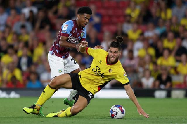 WATFORD, ENGLAND - AUGUST 12: Ian Maatsen of Burnley challenges Francisco Sierralta of Watford during the Sky Bet Championship between Watford and Burnley at Vicarage Road on August 12, 2022 in Watford, England. (Photo by Richard Heathcote/Getty Images)